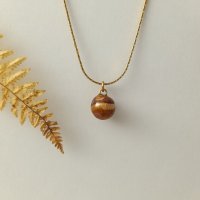 Collier "sphère bois de pigne" doré